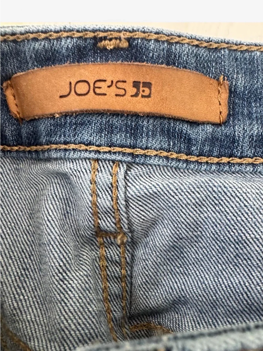 Joe’s Jeans Vintage Reserve 1971 denim shorts in a mid blue wash.